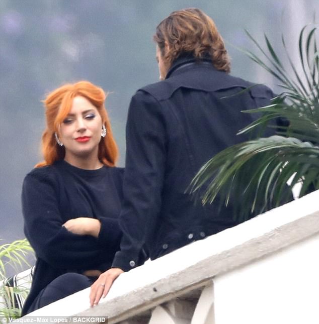 Lady Gaga dyes her brunette tresses a fiery hue to shoot scenes with Bradley Cooper for A Star Is Born