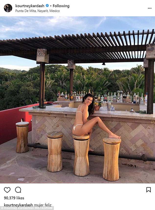 Cheeky! Bikini-clad Kourtney Kardashian sizzles as she showcases peachy backside during Mexican trip