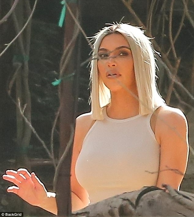 Kim Kardashian ditches her ‘Bo Derek braids’ to shoot KUWTK in Malibu with her bra-flashing sister Kourtney