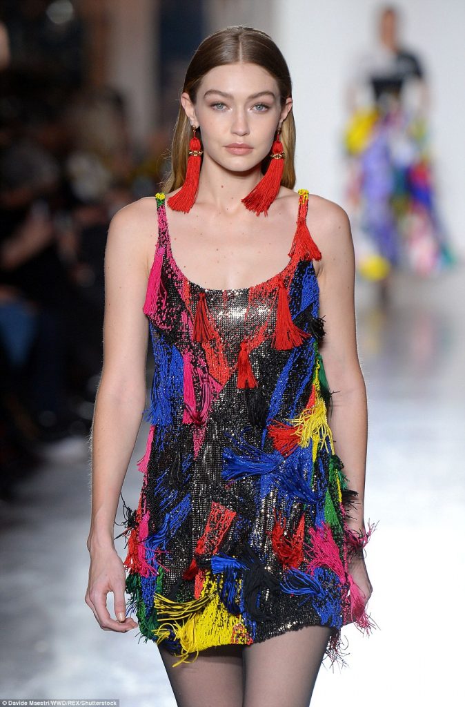 Gigi Hadid rocks a rainbow mini-dress as she and denim-clad Kaia Gerber lead the VERY colourful runway at Versace show during Milan Fashion Week