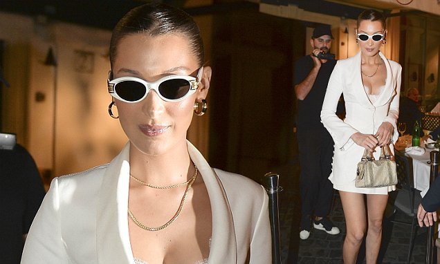 Bella Hadid shows off her ample assets in plunging White Blazer teamed with quirky ankle in Rome