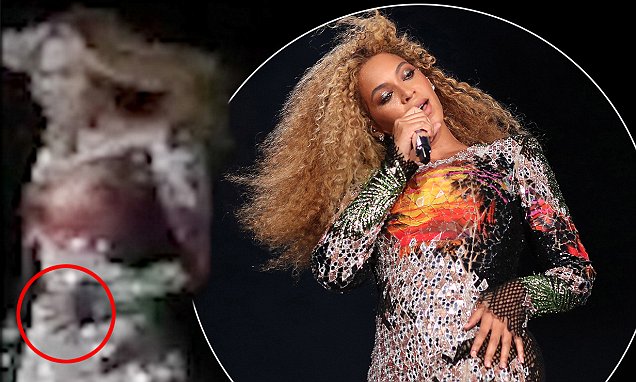 Beyonce cradles her stomach during Performance in Rome