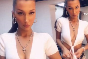 Bella Hadid fools around with Cleavage-baring crop top in mock Striptease