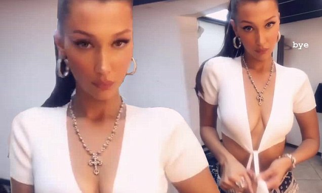 Bella Hadid fools around with Cleavage-baring crop top in mock Striptease