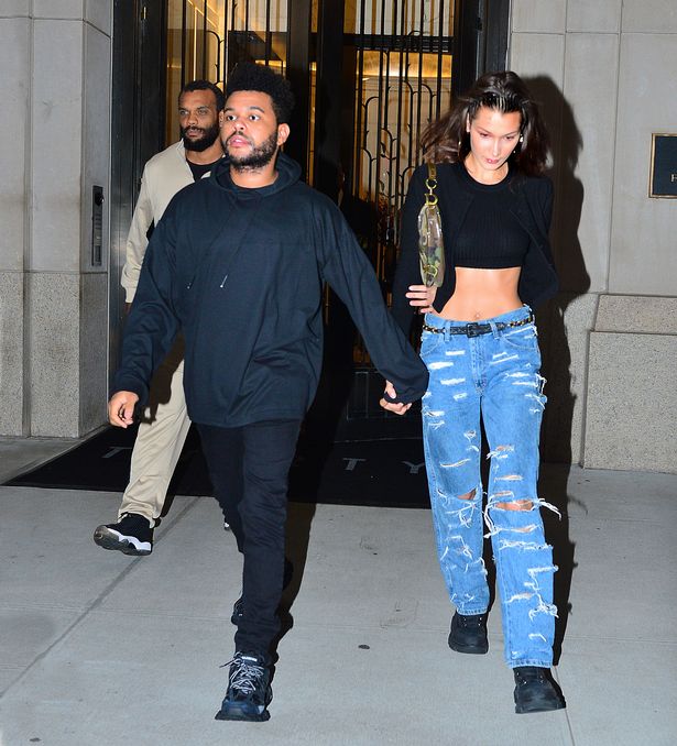 Bella Hadid flashes her slim waist as she leaves New York apartment with The Weeknd