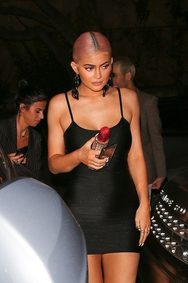 Kylie Jenner shows off her curves in a tiny LBD as she joins family at cosmetics party