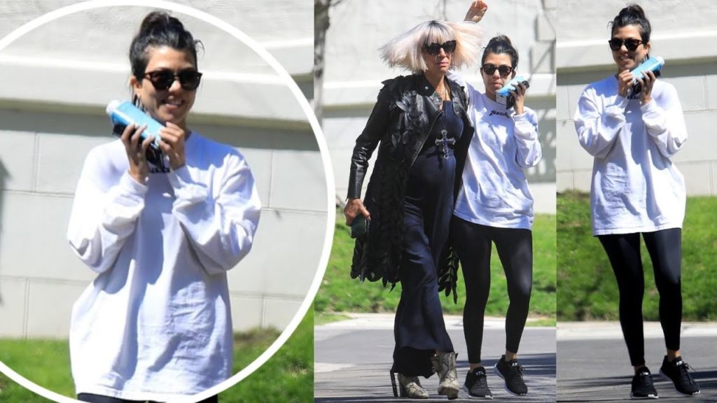 Kourtney Kardashian cuts a relaxed figure in a sweatshirt and leggings